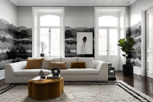 a living room with a white couch and a rug