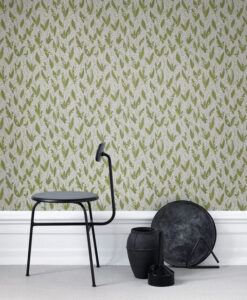 a chair and a vase in front of a wallpaper